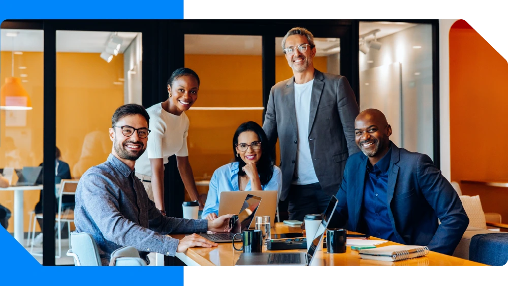 Team smiling at camera